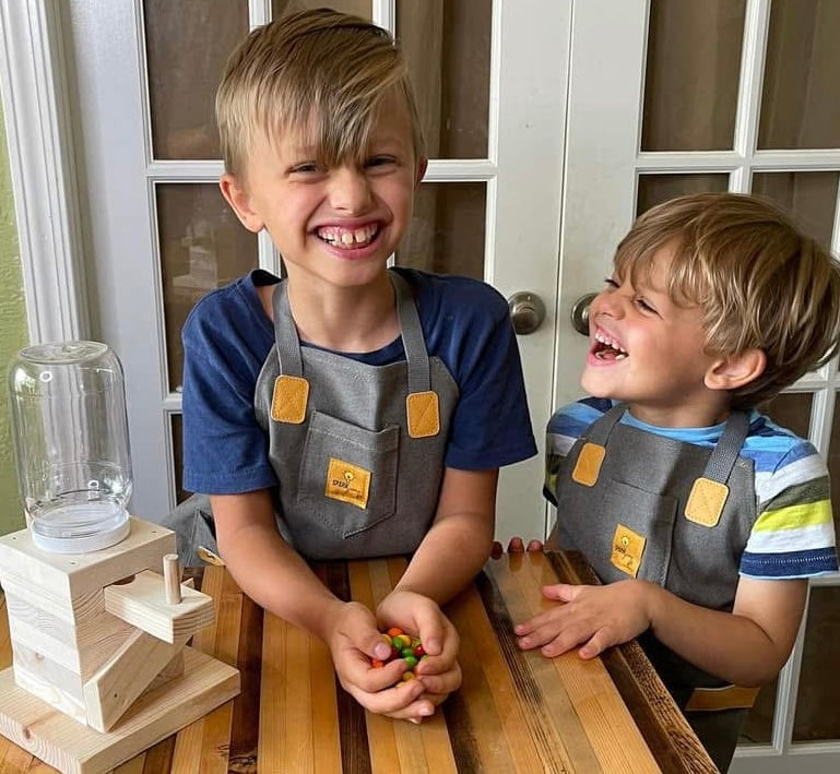 Two children building SparkJump woodworking kits. The Little Makers Bundle ages 6-9 Australia